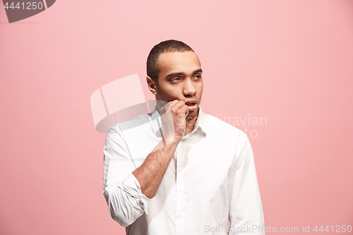 Image of Beautiful bored man bored isolated on pink background