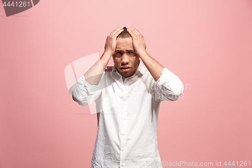 Image of Handsome man in stress isolated on pink