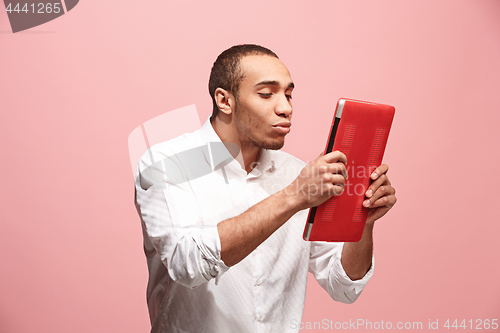 Image of Businessman hugging laptop