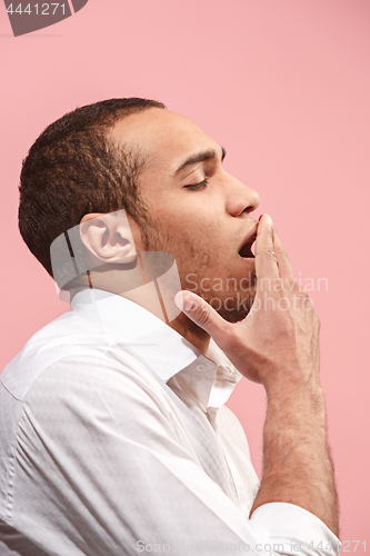 Image of Beautiful bored man bored isolated on pink background