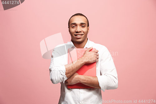Image of Businessman hugging laptop
