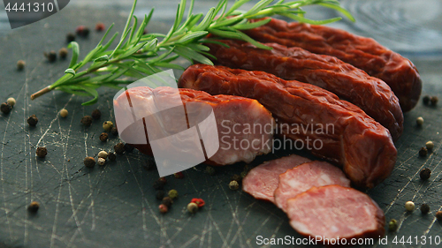 Image of Smoked sausage and spices on board