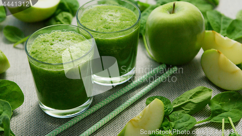 Image of Green smoothie in glasses and ingredients