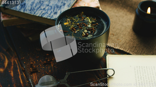 Image of Cup of tea among books