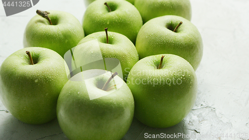 Image of Ripe green apples in drops