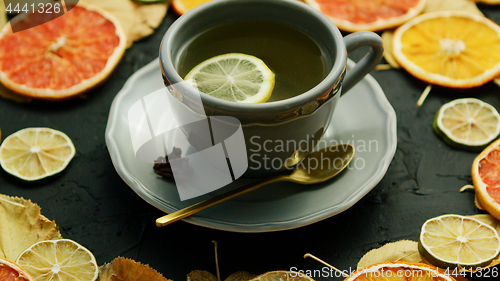 Image of Cup of tea with lemon and spoon