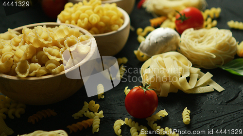 Image of Bowls full of macaroni and tomatoes