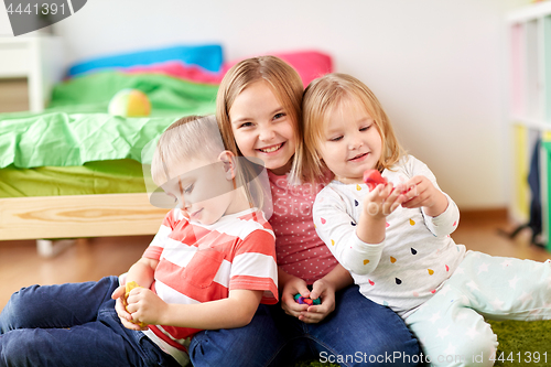 Image of kids with modelling clay or slimes at home