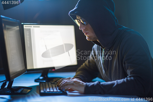 Image of hacker using computer virus for cyber attack