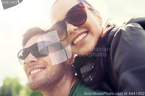 Image of happy couple having fun outdoors