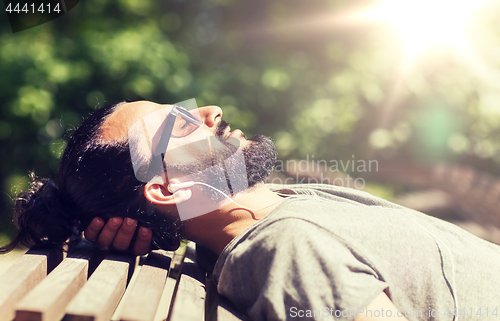 Image of happy man with earphones listening to music