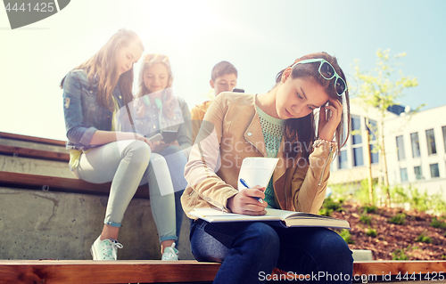 Image of student girl suffering of classmates mockery