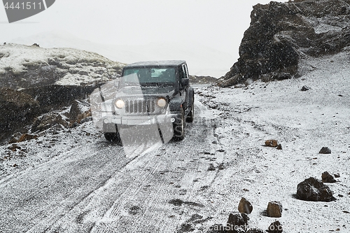 Image of Jeep Wrangler on Icelandic terrain with snow