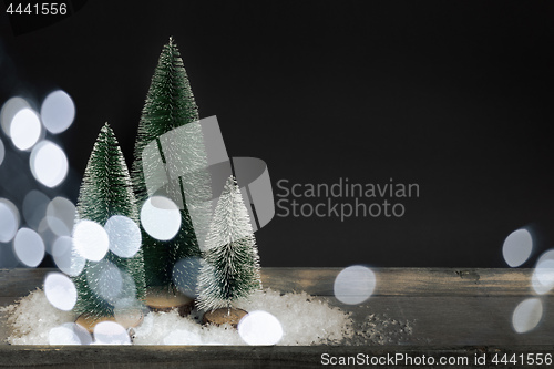 Image of Christmas decoration with three trees and space for your message