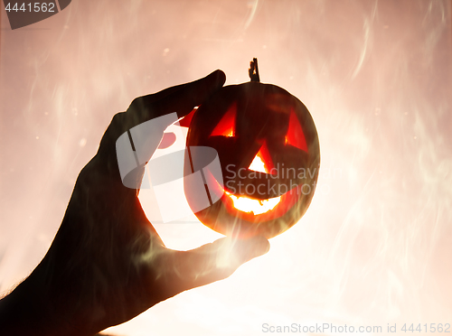 Image of pumpkin on ominous foggy background