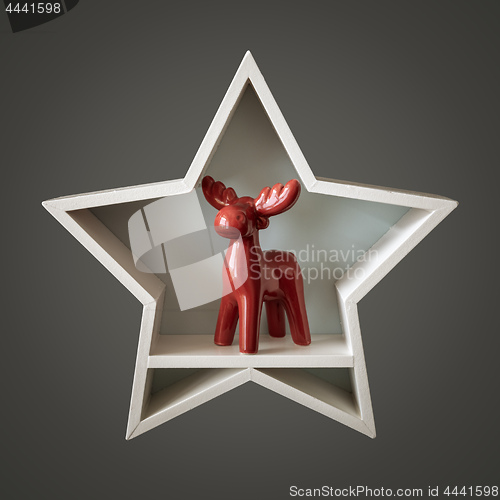 Image of Christmas decoration white star with red deer inside