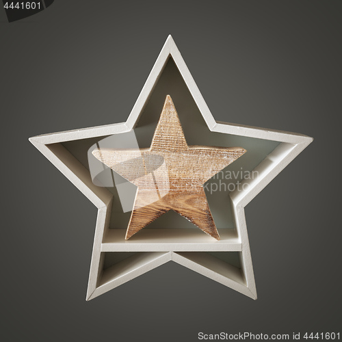 Image of Christmas decoration white star with wooden star inside