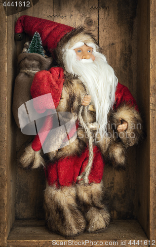 Image of Santa Claus figure in a wooden box