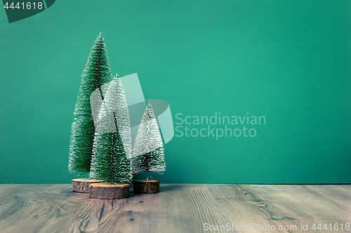 Image of Christmas decoration green fir trees figure on green backgound