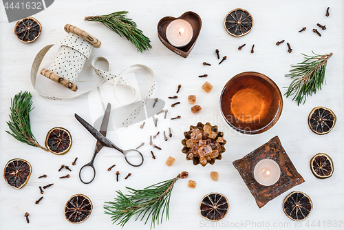 Image of Christmas decor with candles, teacup and vintage items