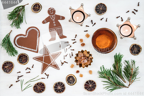 Image of Nordic Christmas decor with candles, tea and ginger biscuits