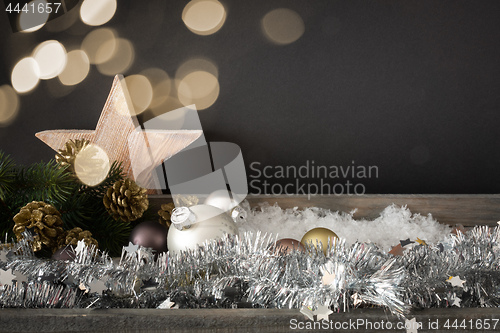 Image of Christmas decoration with glass balls wooden star and bokeh ligh