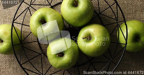 Image of Green wet apples in vase