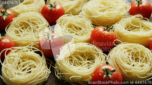 Image of Spaghetti in rolls with fresh tomatoes