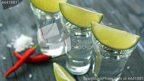 Image of Served shots with tequila and lime slices