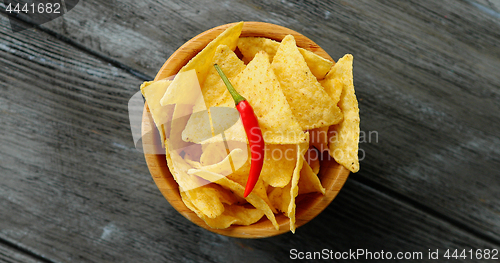 Image of Bowl of corn chips and chili pepper