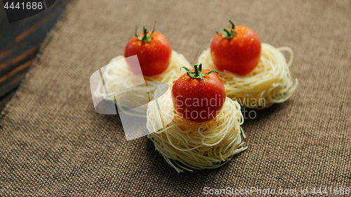 Image of Rolled spaghetti with tomatoes