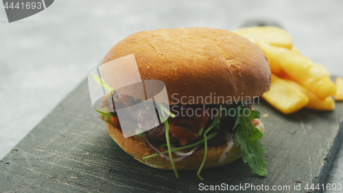 Image of Juicy delicious burger on plate