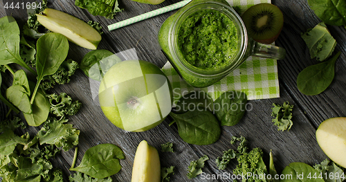 Image of Green fruits and salad in composition