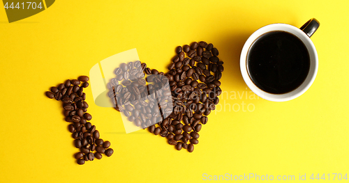 Image of Cup of coffee and brown beans