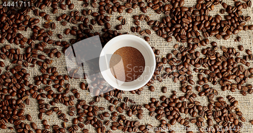 Image of Coffee beans and cup of powder