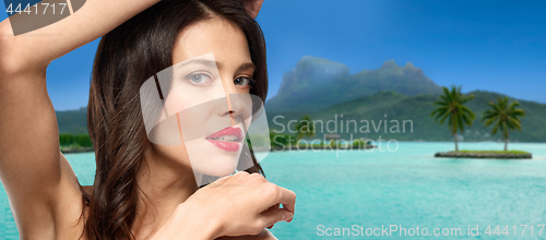 Image of close up of beautiful woman over bora bora beach