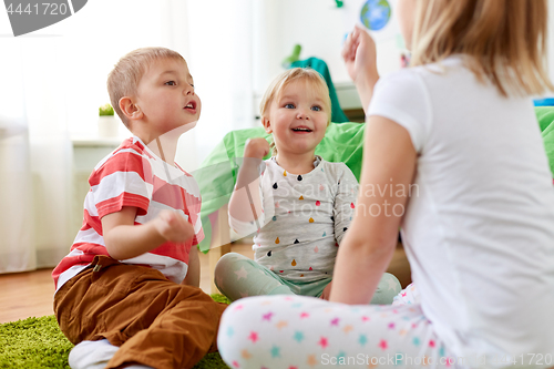 Image of kids playing rock-paper-scissors game at home