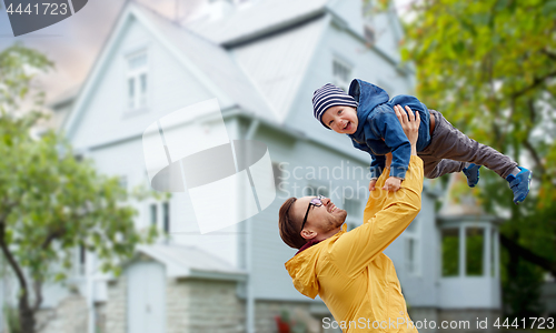 Image of father with son playing and having fun outdoors