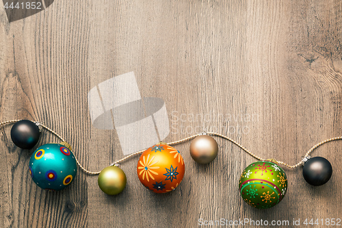 Image of Christmas decoration glass balls on a wooden background