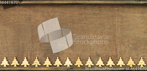 Image of Christmas decoration wooden background with row of small wooden 