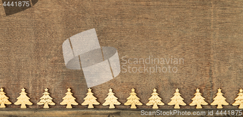 Image of Christmas decoration wooden background with row of small wooden 