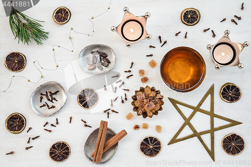 Image of Cozy Christmas composition with candles and teacup