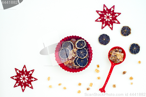 Image of Christmas decor with brown sugar and dried lemon slices