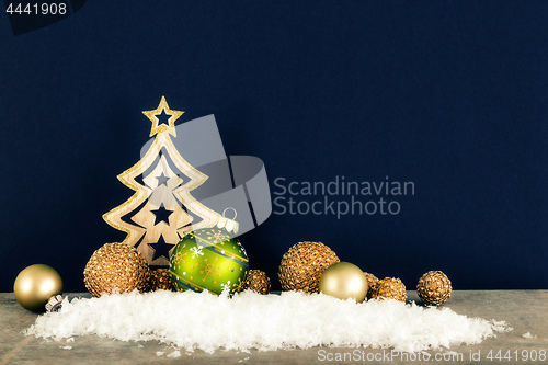 Image of Christmas decoration dark background with wooden tree glass ball