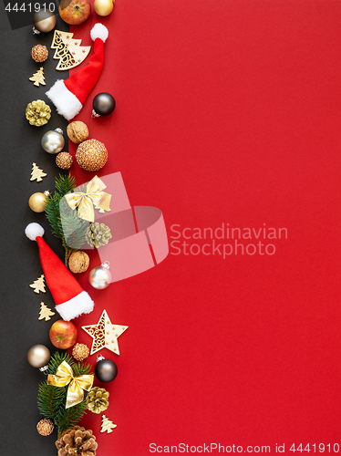 Image of Christmas decoration background red with santa hats glass balls 