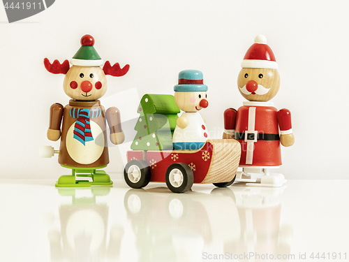 Image of three Christmas figures reindeer Santa Claus toys