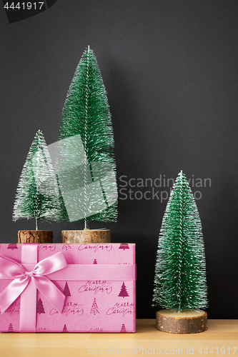 Image of Christmas decoration green fir trees figure on wooden ground