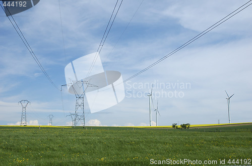 Image of Electric pylons close to windturbines