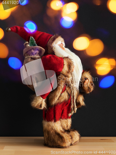 Image of Santa Claus figure bokeh lights