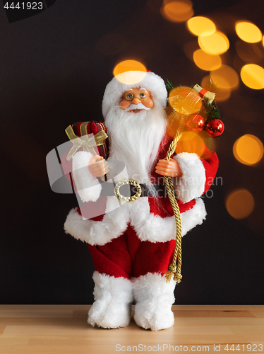 Image of Santa Claus figure bokeh lights